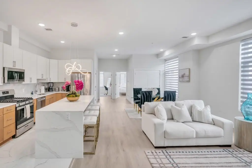 Open living area flowing into kitchen, Residence 402