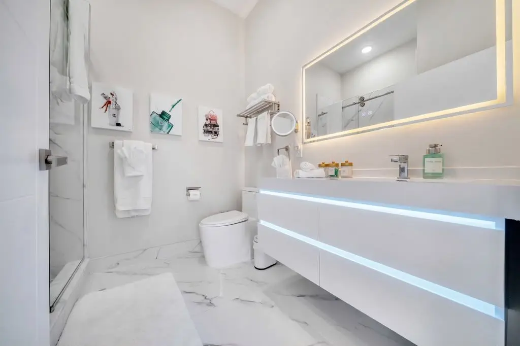 Bathroom with glass shower and LED vanity mirror, Residence 402