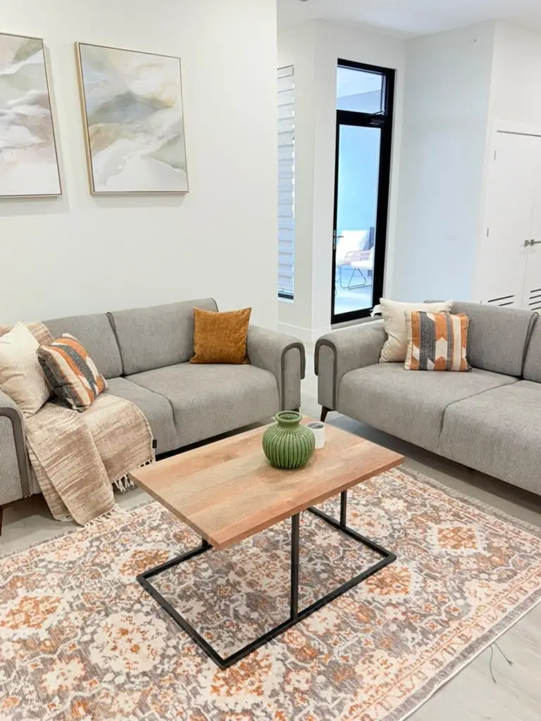 Living area with two sofas and coffee table, Residence 411