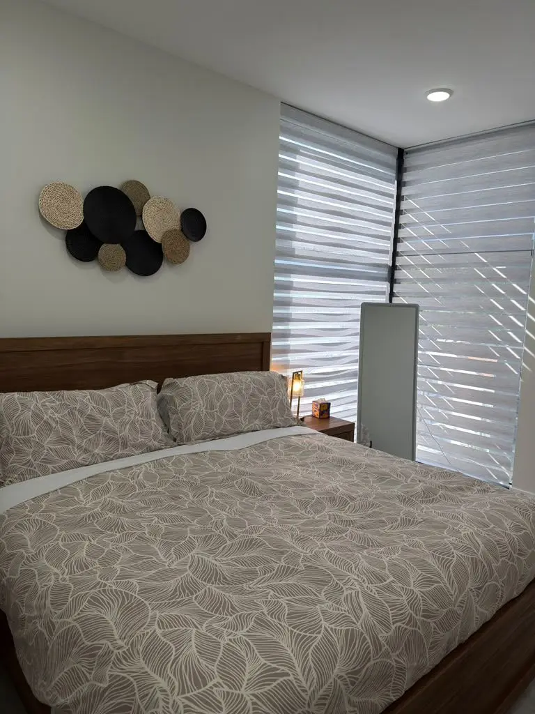 Bedroom with bed and window blinds, Residence 411